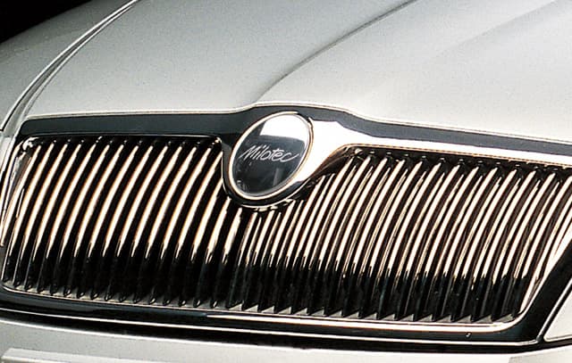 46454 Front emblem trim with "Milotec" inscription